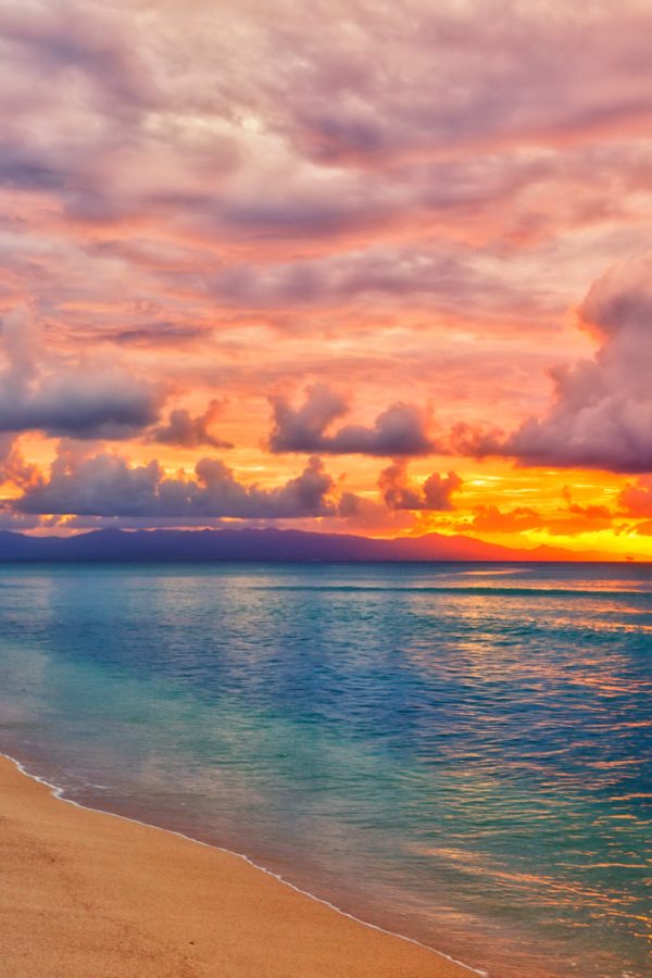 Vibrant sunset at caribbean island beach